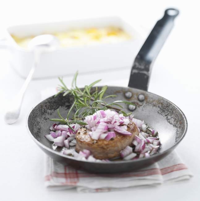 Pork fillet with red onions — Stock Photo