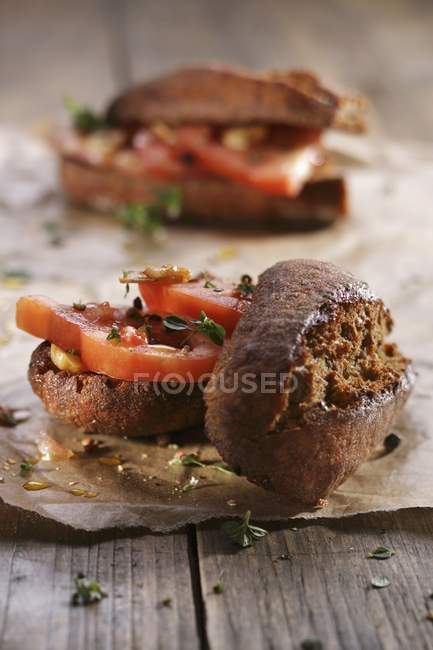 Bread rolls with tomatoes — Stock Photo