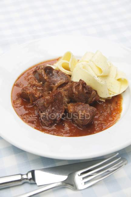 Venison goulash with tagliatelle pasta — Stock Photo