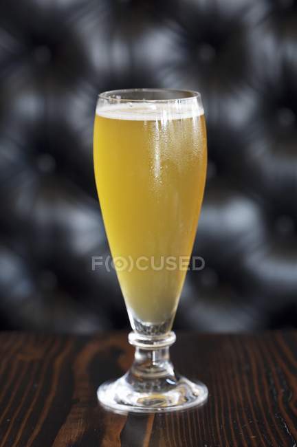 Glass of beer on wooden — Stock Photo