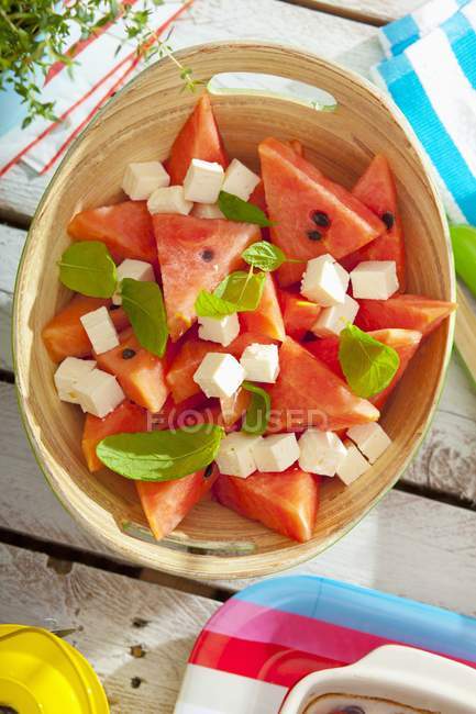 Watermelon salad with brynza cheeses and basil — Stock Photo