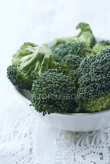 Fresh broccoli in white bowl — Stock Photo