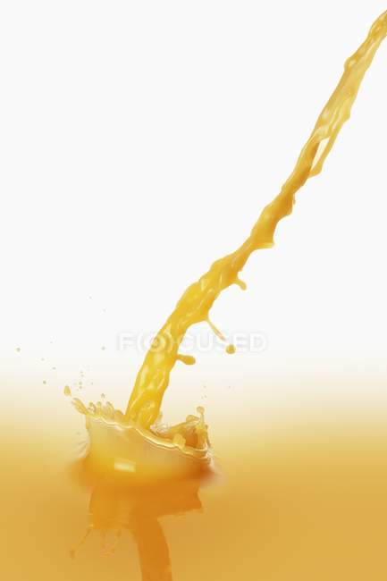 Orange Juice splashing — Stock Photo