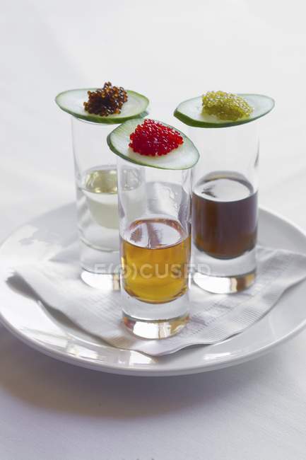 Closeup view of three shots with assorted caviar top — Stock Photo