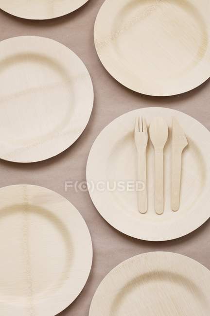 Top view of bamboo plates and flatware — Stock Photo