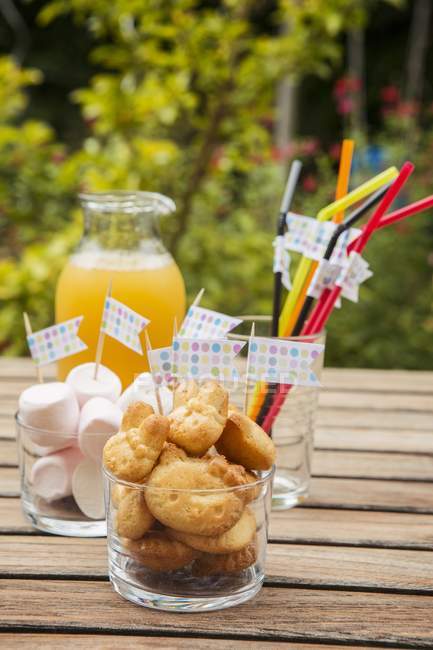 Baked treats on table outdoors — Stock Photo