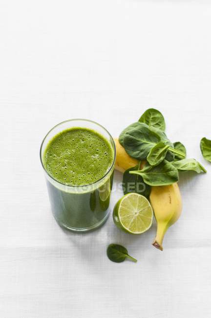 Smoothie with banana in glass — Stock Photo