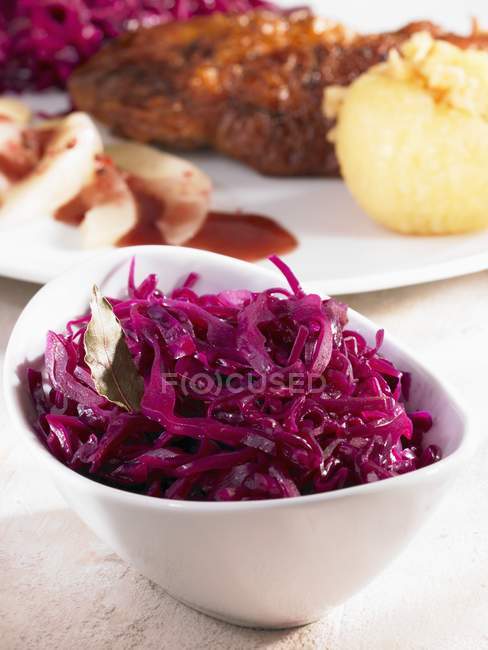 Red cabbage in a bowl as an accompaniment in white dish — Stock Photo