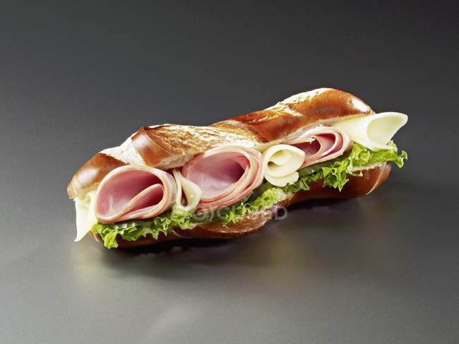 Pretzel roll with ham — Stock Photo