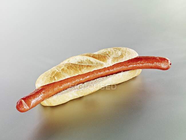 Baguette roll with sausage — Stock Photo