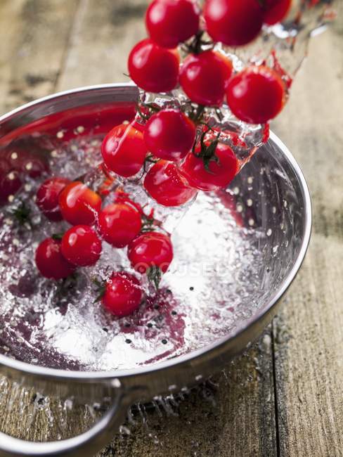 Red Tomatoes with water splash — Stock Photo