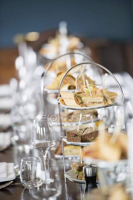 Elevated view of assorted canapes on layered stands — Stock Photo