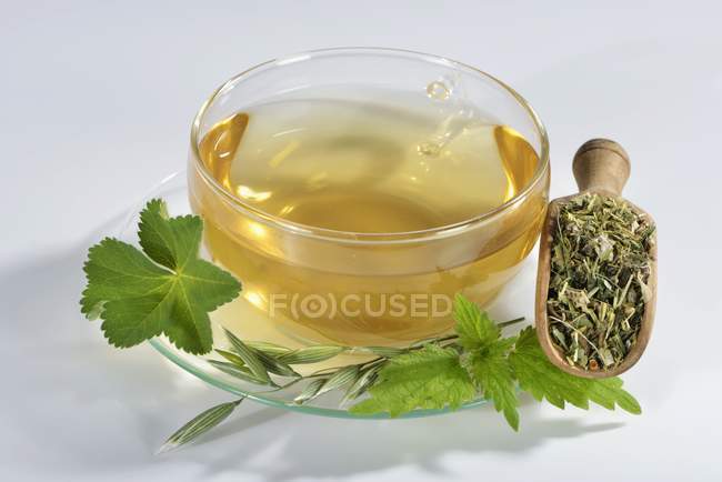 Herbal tea in glass cup — Stock Photo