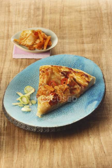 Pizza slice with kimchi — Stock Photo