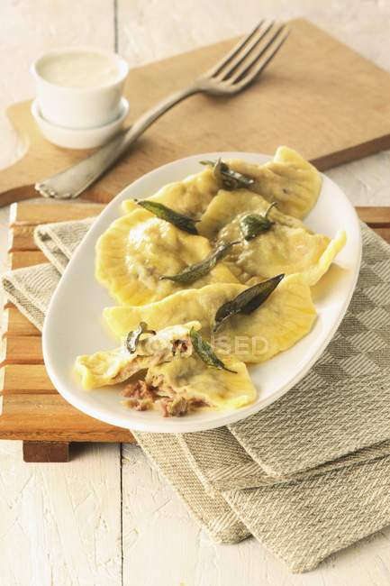 Swabian ravioli with fried sage — Stock Photo