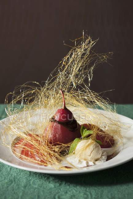 Pear poached in red wine — Stock Photo