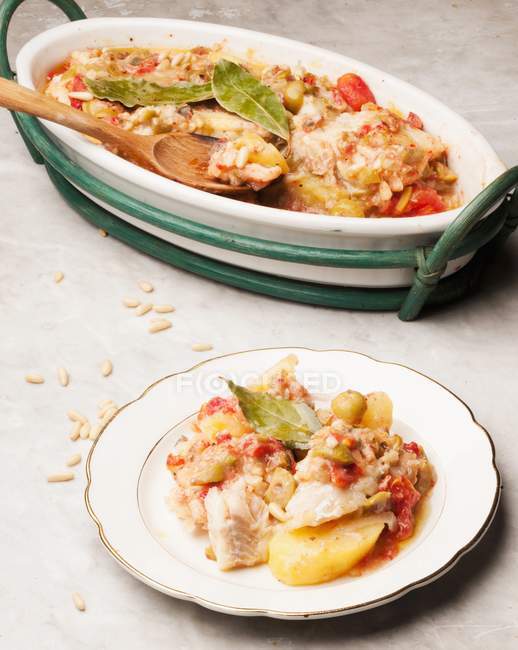 Salt cod with potatoes and olives — Stock Photo
