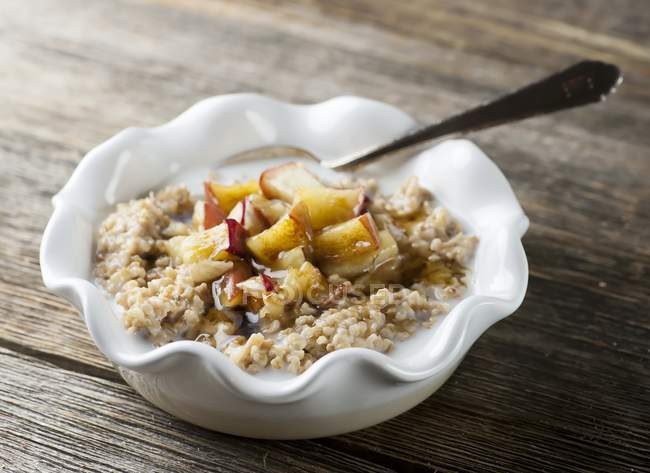 Closeup view of oats with butter, milk and fruit — Stock Photo
