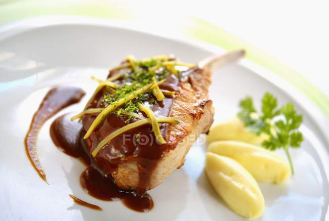 Pork chop on bed on mashed potatoes — Stock Photo