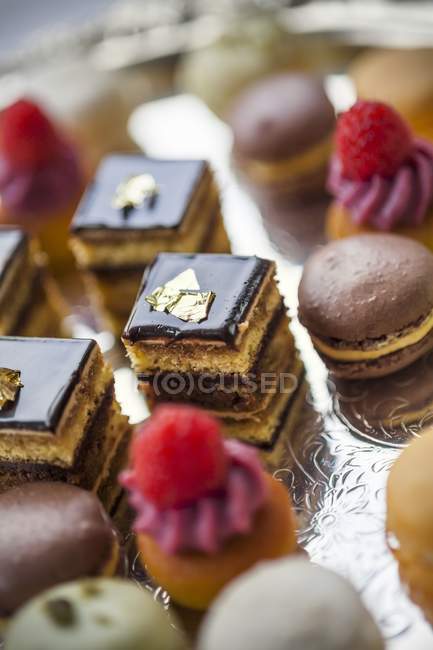 Small cakes on silver stand — Stock Photo