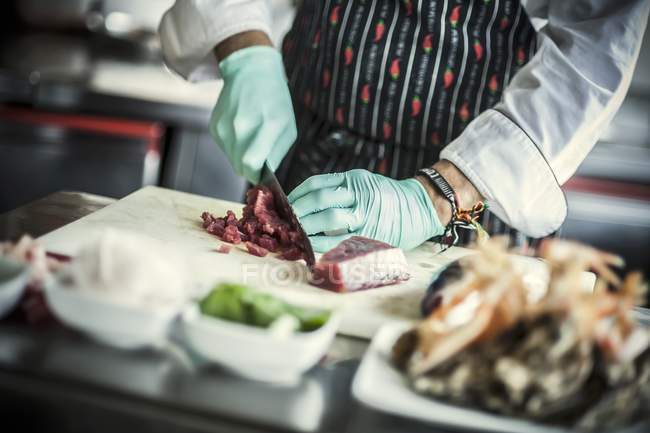 Chef cutting up tuna fish — Stock Photo