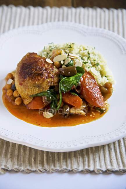 Braised chicken with vegetables and couscous — Stock Photo