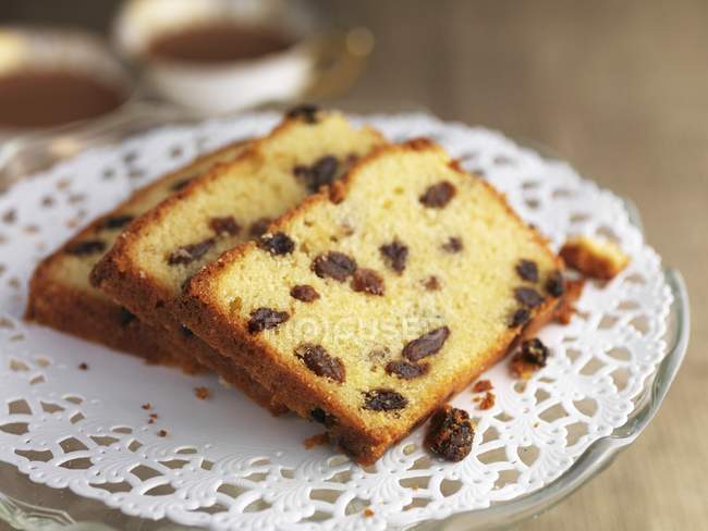 Slices of almond and sultana cake — Stock Photo