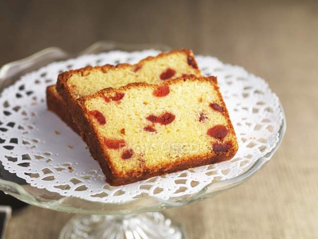 Slices of almond and cherry cake — Stock Photo