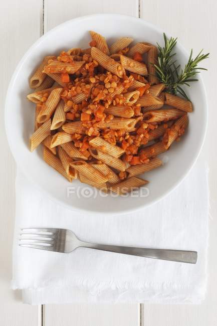 Penne pasta with vegan lentil sauce — Stock Photo