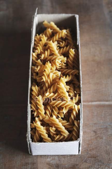 Raw wholemeal fusilli pasta — Stock Photo