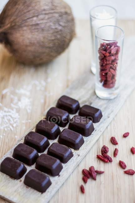 Filled chocolates with goji berries — Stock Photo