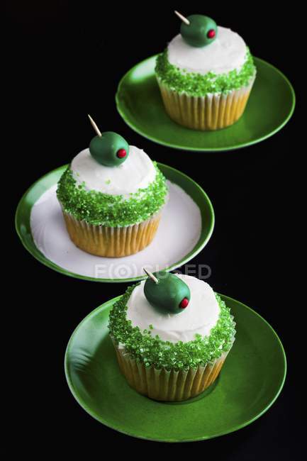 Martini cupcakes on plates — Stock Photo