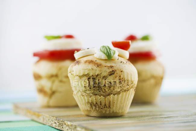 Pizza muffins on chopping board — Stock Photo