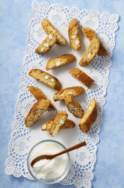 Top view of Biscotti on doily with sugar bowl — Stock Photo