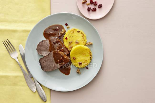 Roast beef with cranberry sauce — Stock Photo