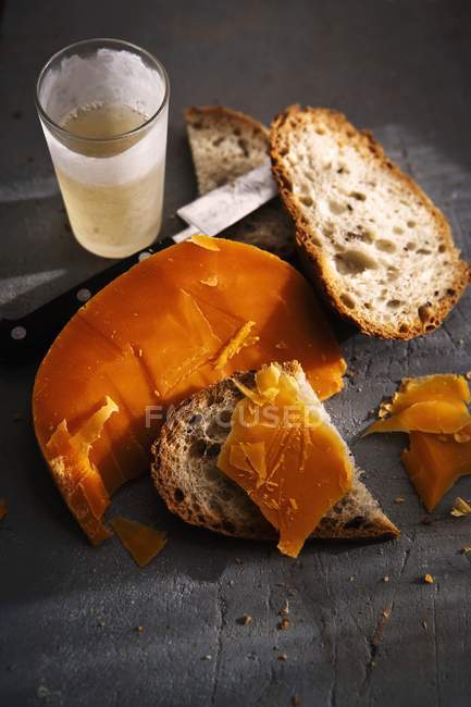 Loafs of bread and cheese — Stock Photo