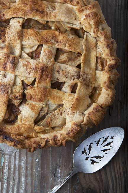 Apple pie on a wooden surface — Stock Photo