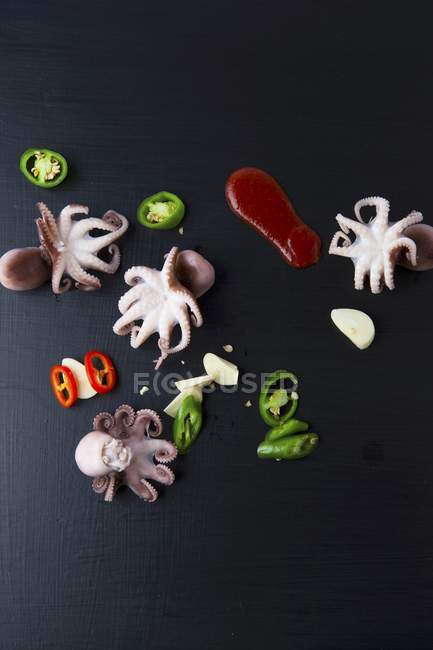 Octopuses with jalapenos and garlic — Stock Photo