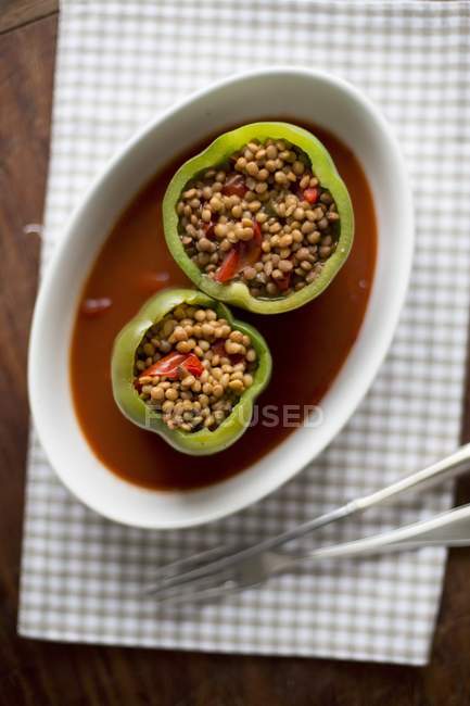 Top view of peppers filled with lentils — Stock Photo