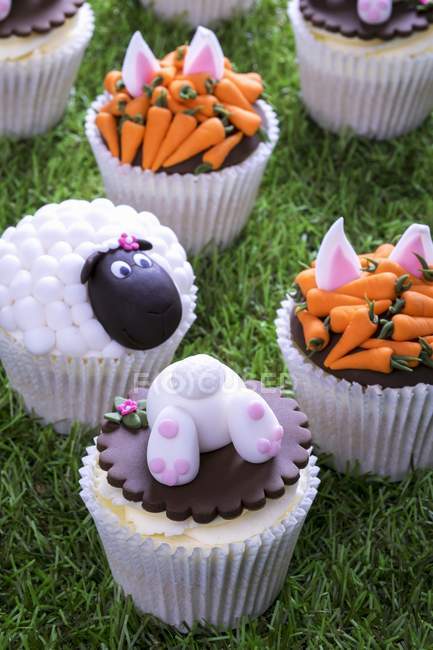 Easter cupcakes on grass surface — Stock Photo