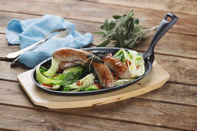 Sausages with bok choy — Stock Photo