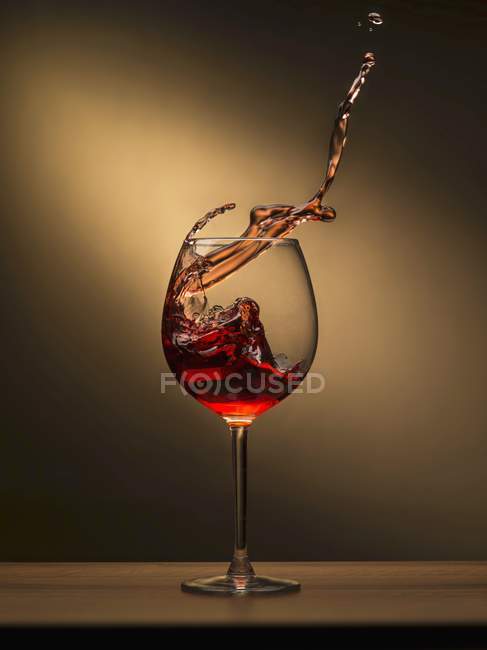Red wine splashing — Stock Photo