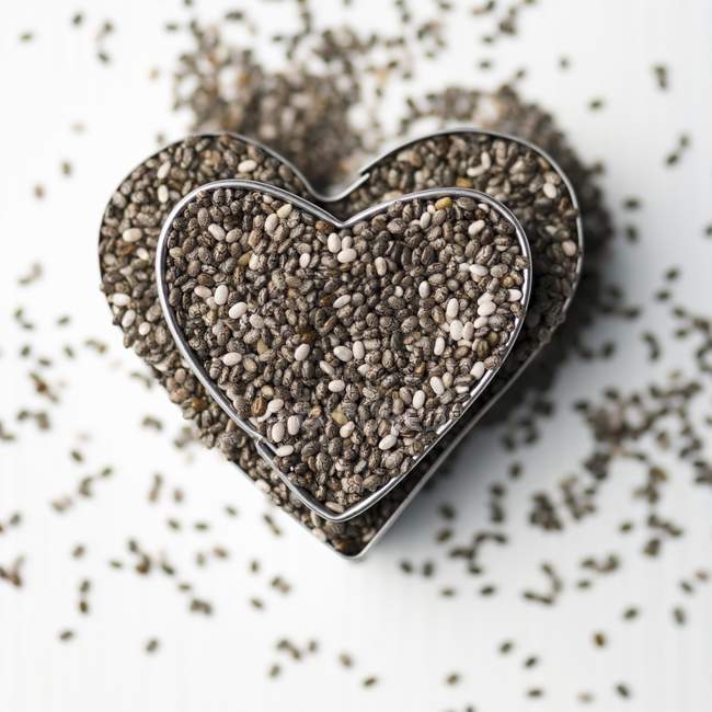 Chia seeds in cutters — Stock Photo