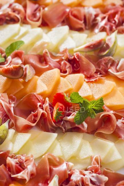 Party platter of melon and ham — Stock Photo
