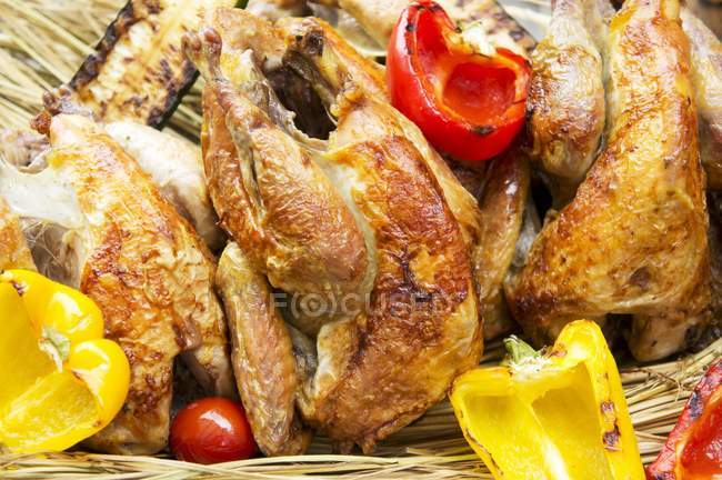 Grilled chickens with peppers — Stock Photo