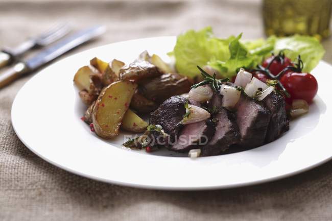 Rump steak on plate — Stock Photo