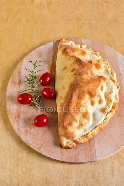 Pizza pocket with tomatoes and mozzarella — Stock Photo