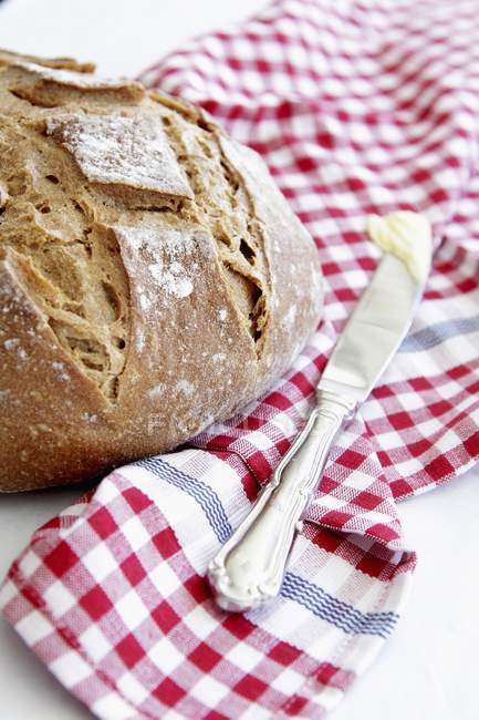 Crusty bread and knife — Stock Photo