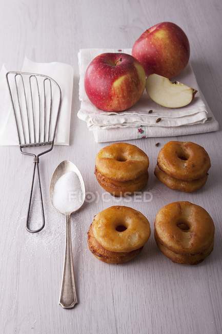 Apple doughnuts on wooden surface — Stock Photo