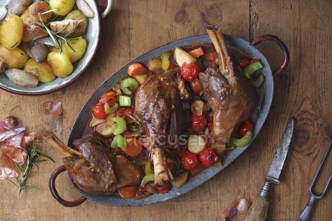 Roasted Legs of lamb with vegetables — Stock Photo